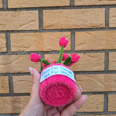 Handmade faux pink tulips crafted from pipe cleaners in a charming pot