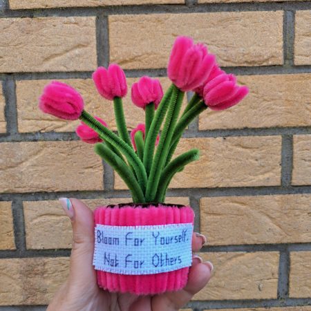 Handmade faux pink tulips crafted from pipe cleaners in a charming pot