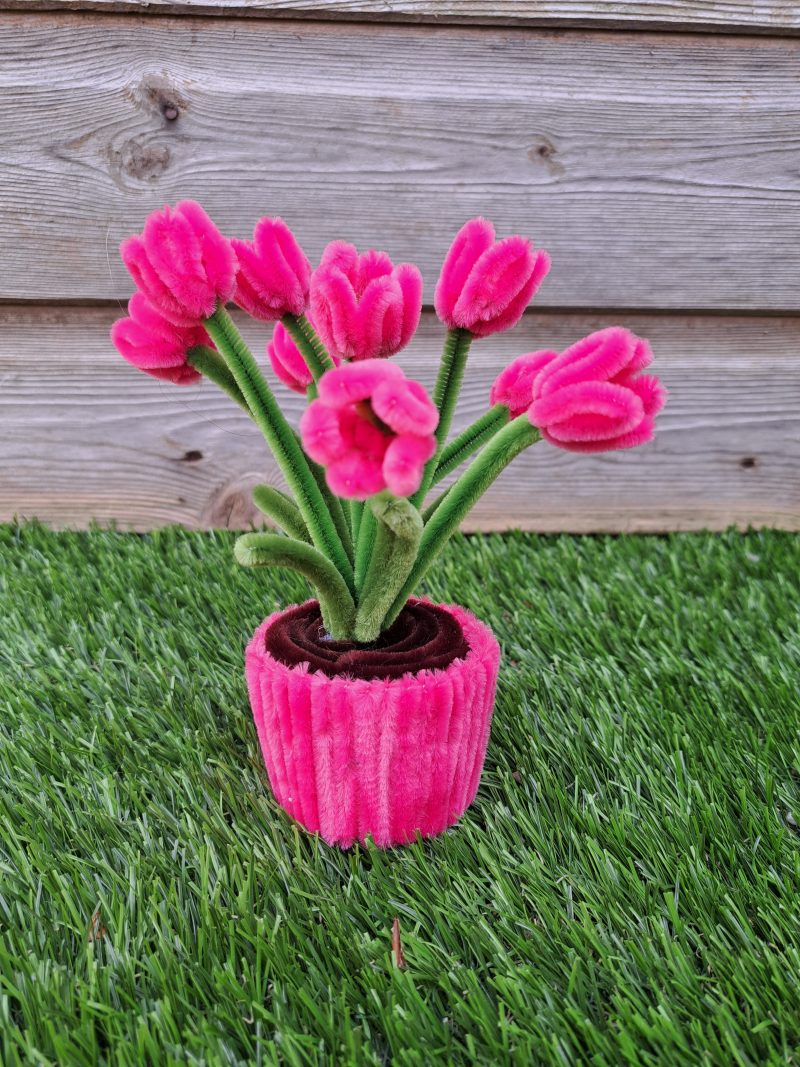 Handmade faux pink tulips crafted from pipe cleaners in a charming pot