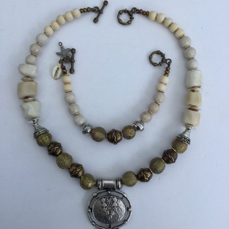 Cream coral and metallic necklace and bracelet