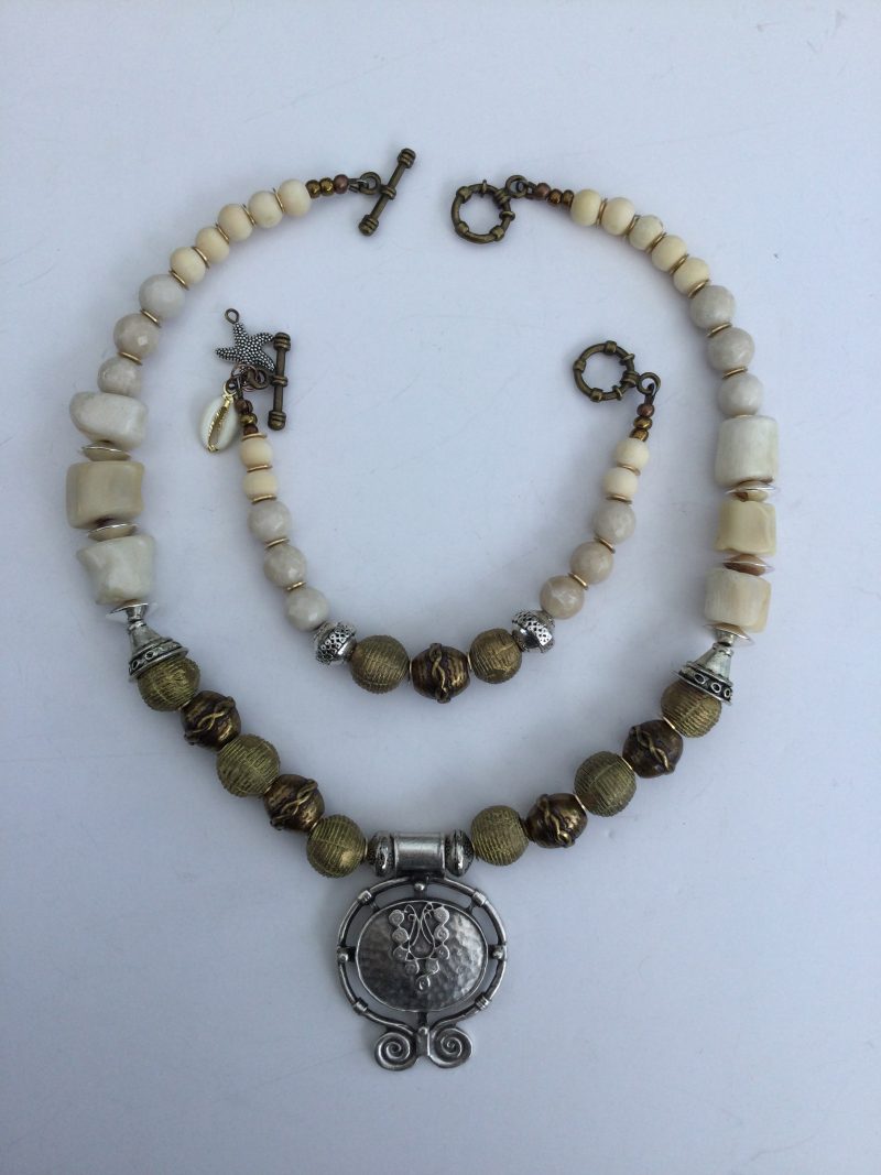 Cream coral and metallic necklace and bracelet