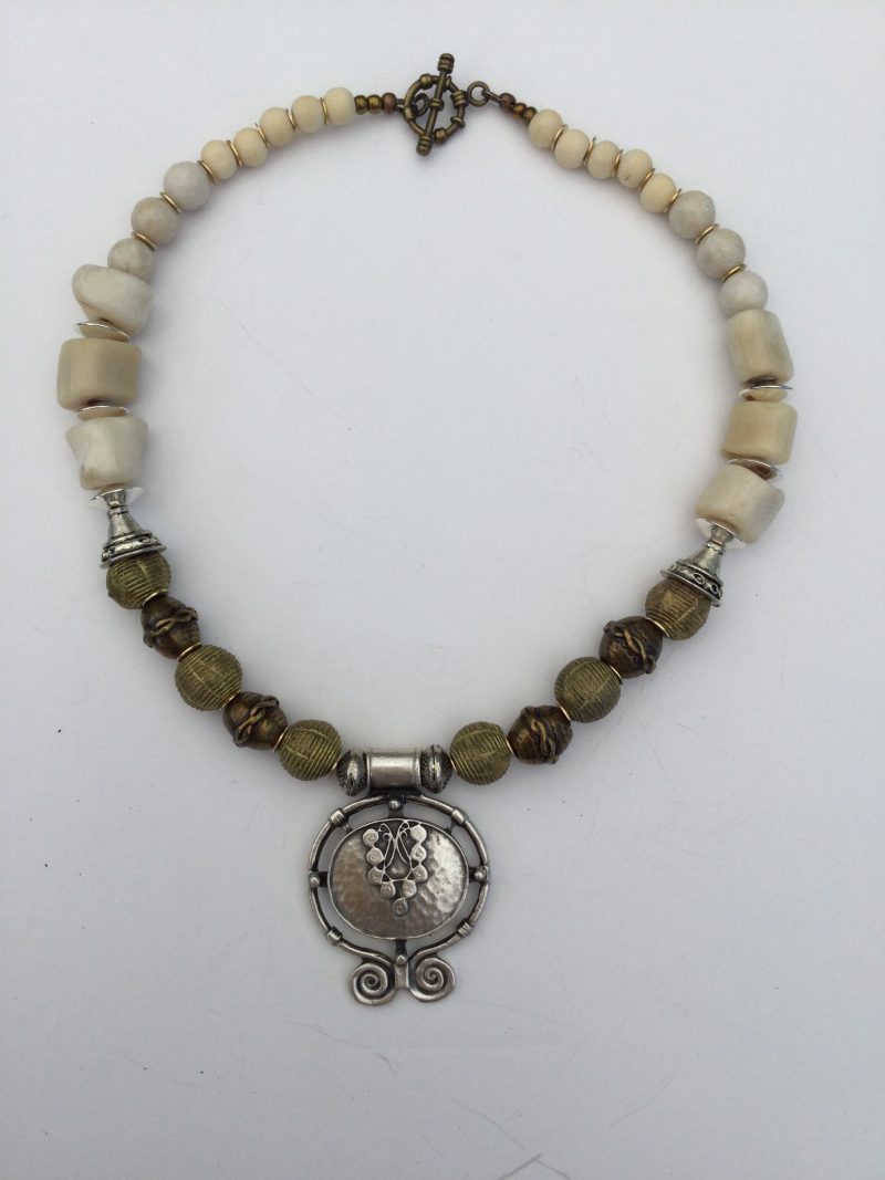 Cream coral and metallic necklace and bracelet