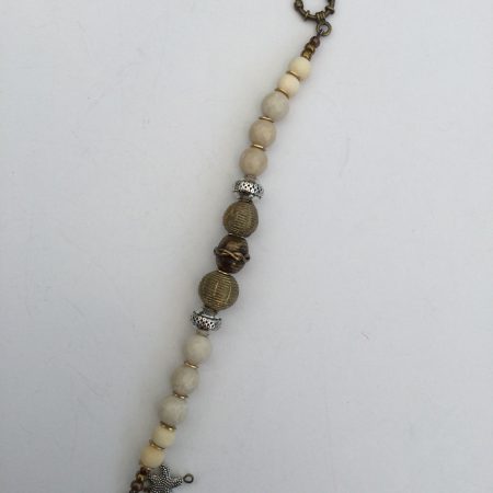 Cream coral and metallic necklace and bracelet