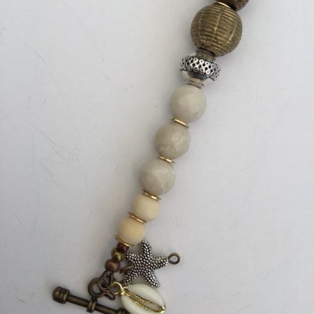 Cream coral and metallic necklace and bracelet