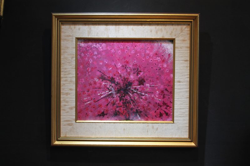 Abstract art depicting a pink ring piece