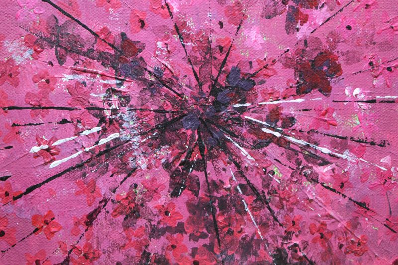 Abstract art depicting a pink ring piece