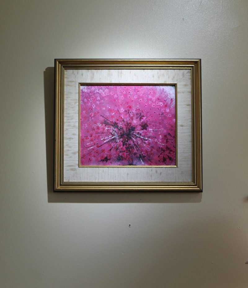 Abstract art depicting a pink ring piece