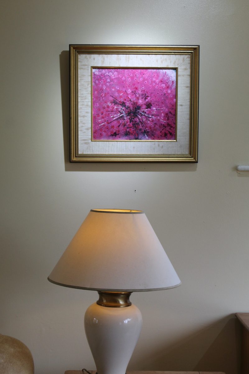 Abstract art depicting a pink ring piece