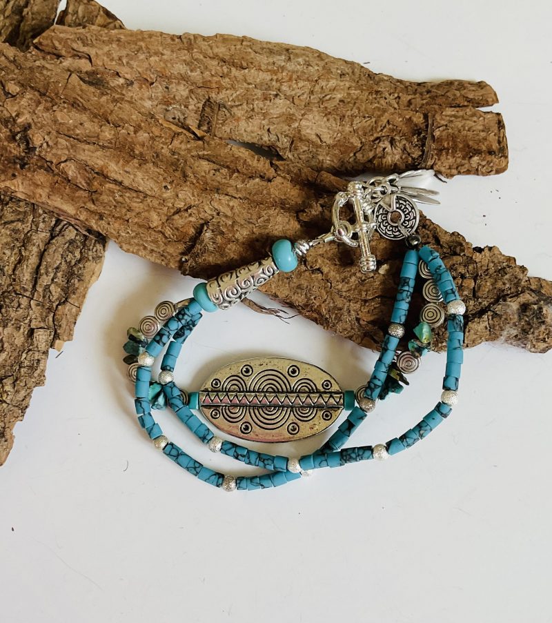 Turquoise and Tibetan silver three strand charm bracelet.