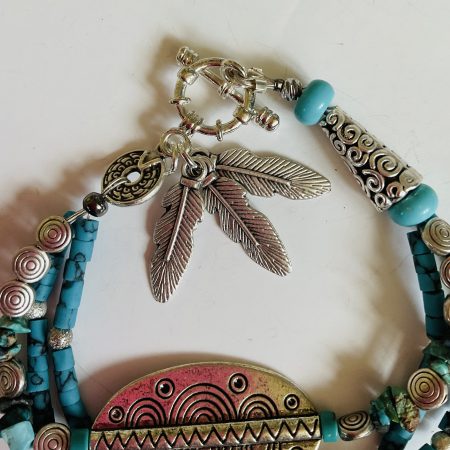 Turquoise and Tibetan silver three strand charm bracelet.