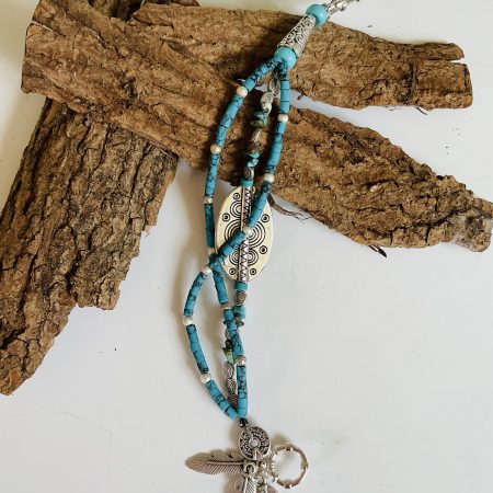 Turquoise and Tibetan silver three strand charm bracelet.