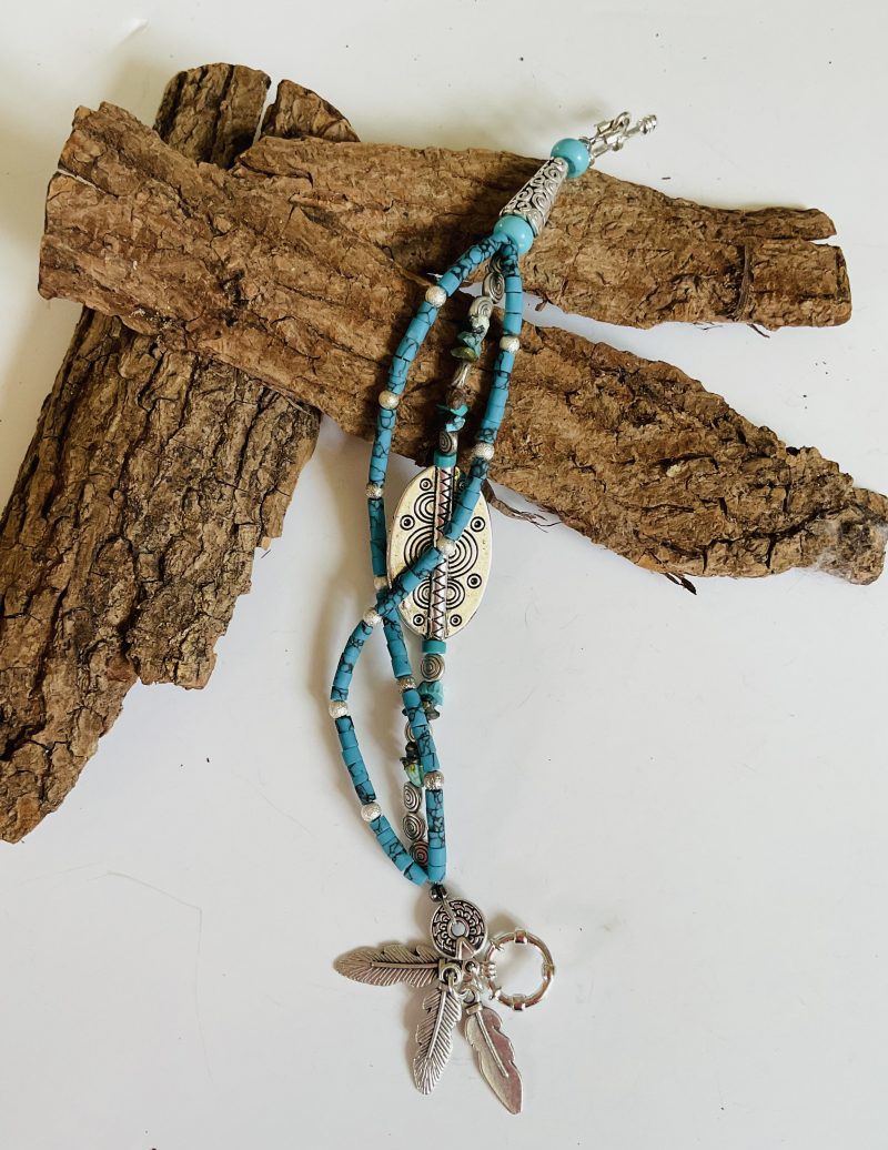 Turquoise and Tibetan silver three strand charm bracelet.