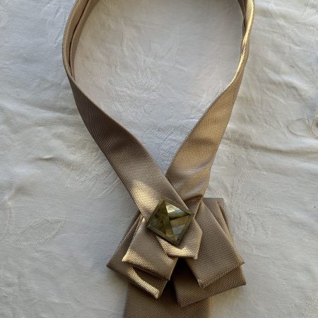 Elegant pendant accessory adorned with a mother pearl and wood and brooch