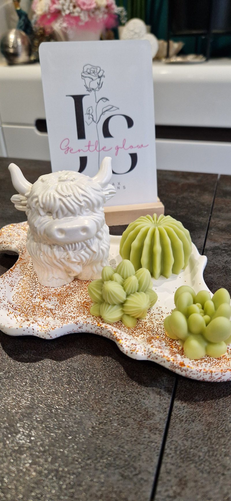 Handcrafted soy wax candle and plaster figure