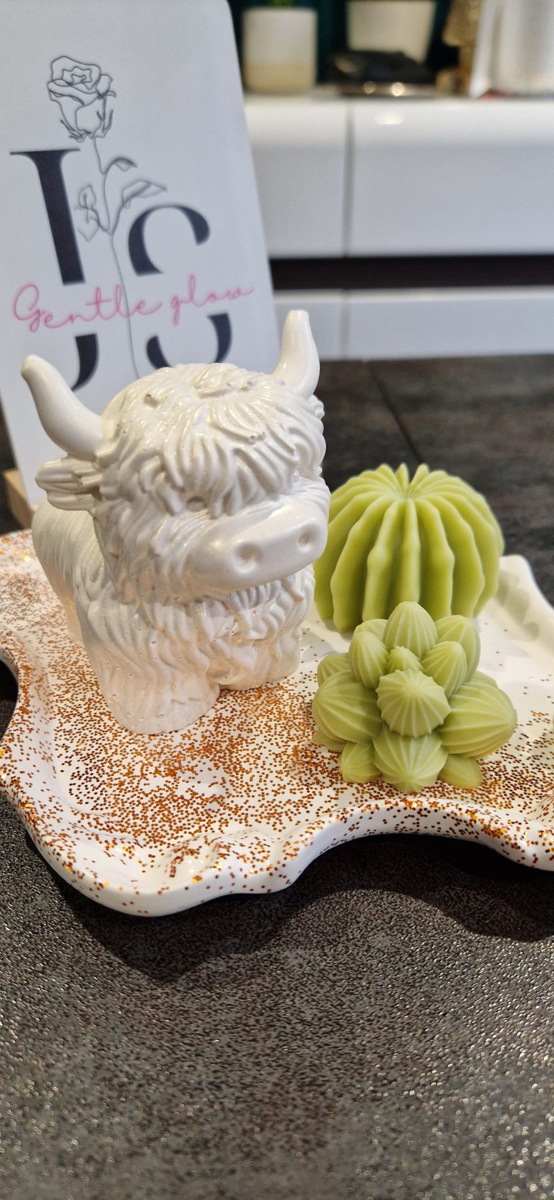 Handcrafted soy wax candle and plaster figure