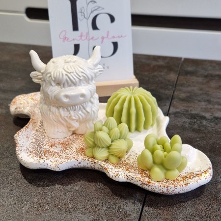 Handcrafted soy wax candle and plaster figure