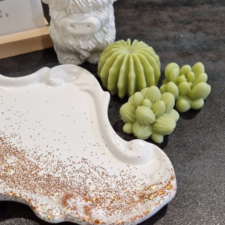 Handcrafted soy wax candle and plaster figure