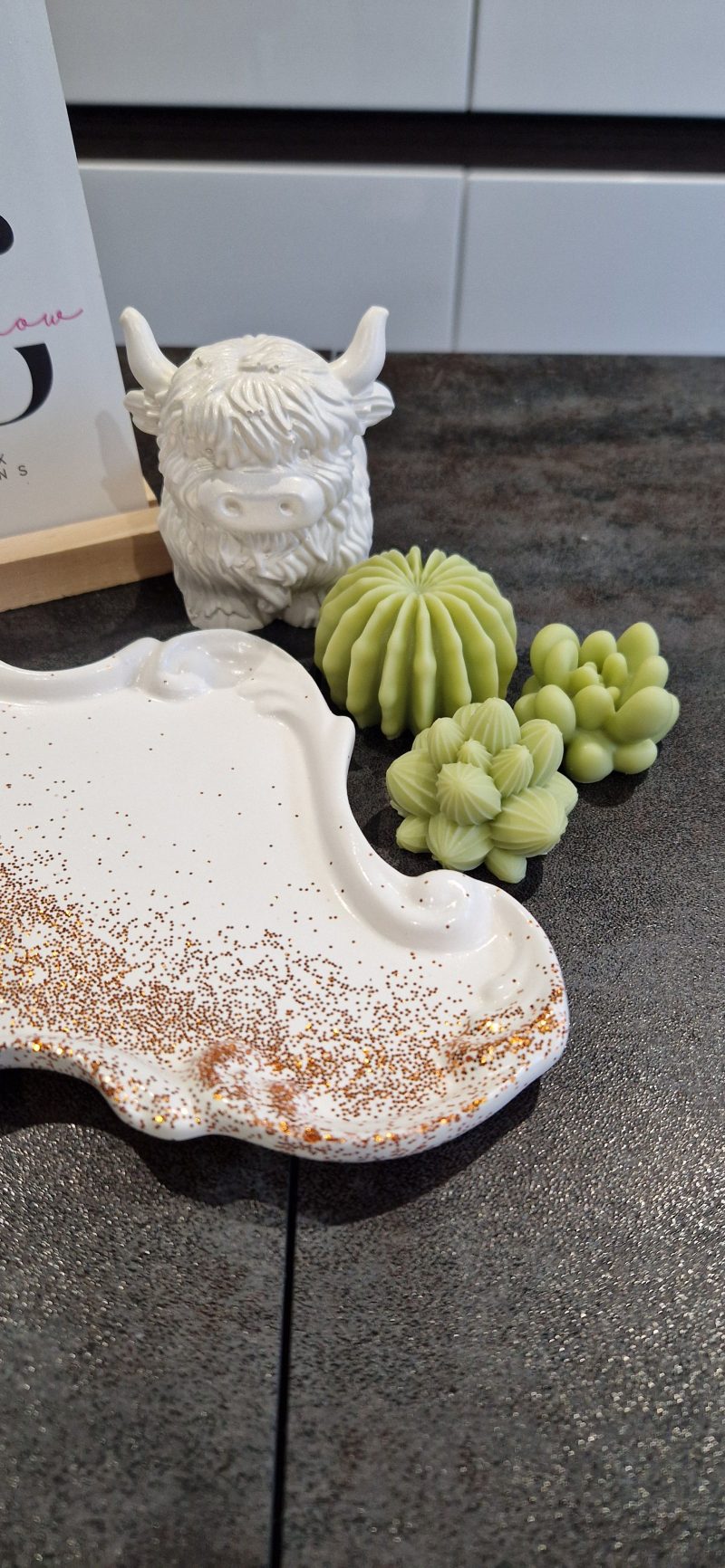 Handcrafted soy wax candle and plaster figure