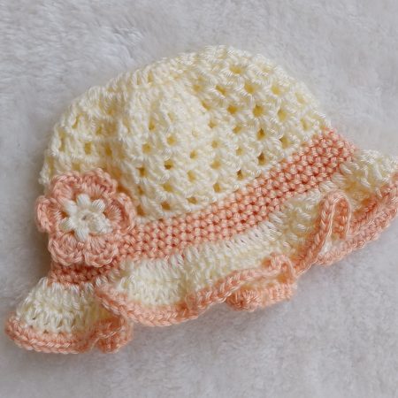 Crochet Peach and Cream Summer Hat with a Ruffle Brim and a Flower Decoration – Sizes New Baby through to Toddler