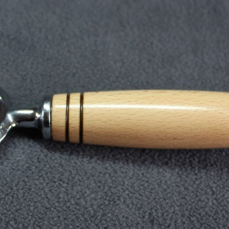 Bottle opener made from beech with a stainless steel opener