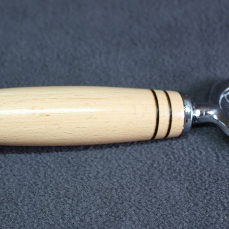 Bottle opener made from beech with a stainless steel opener