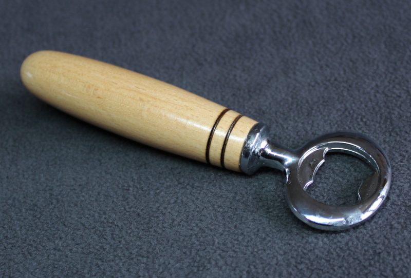 Bottle opener made from beech with a stainless steel opener