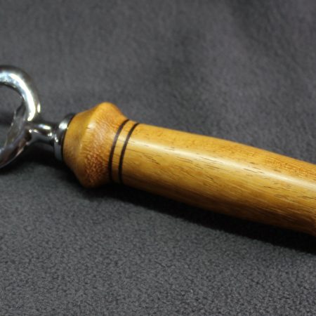 Hand turned Iroko bottle opener with a stainless steel opener