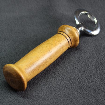 Hand turned Iroko bottle opener with a stainless steel opener