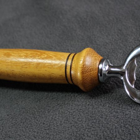Hand turned Iroko bottle opener with a stainless steel opener
