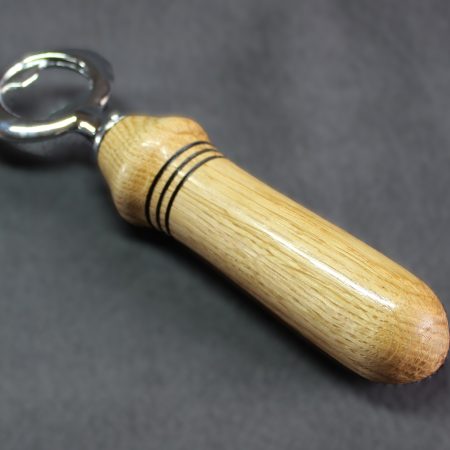 Hand turned oak bottle opener with a stainless steel opener