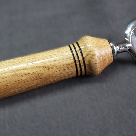 Hand turned oak bottle opener with a stainless steel opener