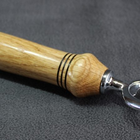 Hand turned oak bottle opener with a stainless steel opener