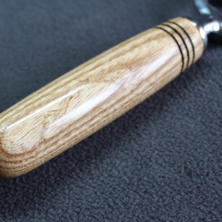 Hand turned ash bottle opener with a stainless steel opener