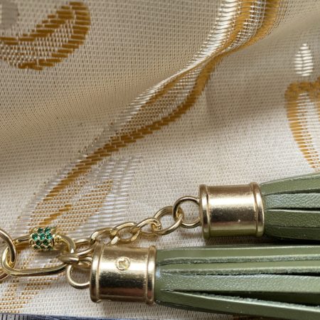Absolutely stunning green bag charm or keyring brass and cubic zaconia imbelishment