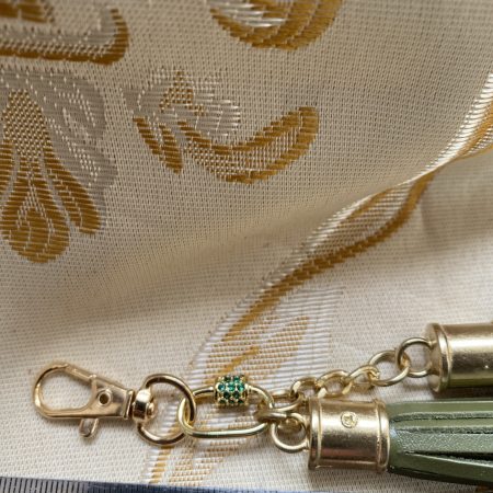Absolutely stunning green bag charm or keyring brass and cubic zaconia imbelishment