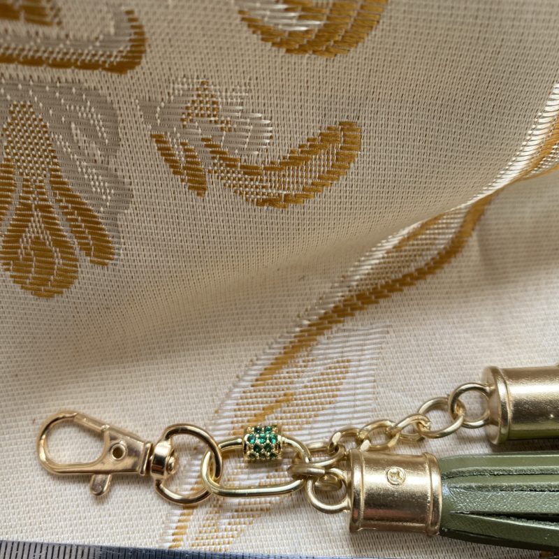 Absolutely stunning green bag charm or keyring brass and cubic zaconia imbelishment