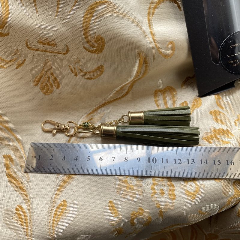 Absolutely stunning green bag charm or keyring brass and cubic zaconia imbelishment