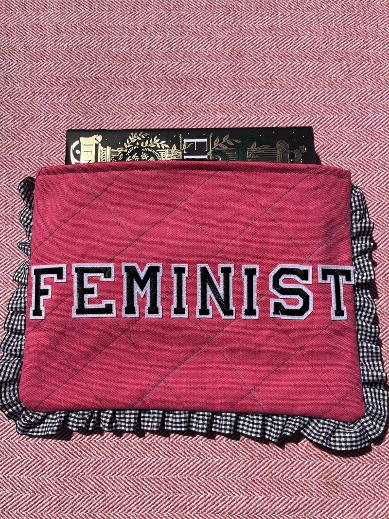 Hand sewn pink quilted book sleeve with slogan