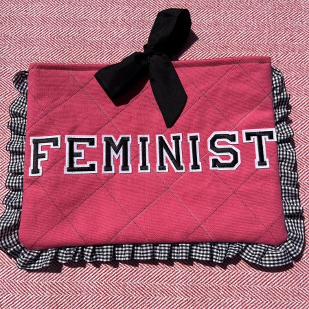 Hand sewn pink quilted book sleeve with slogan