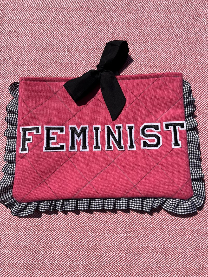 Hand sewn pink quilted book sleeve with slogan