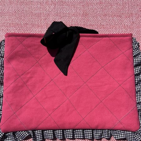 Hand sewn pink quilted book sleeve with slogan