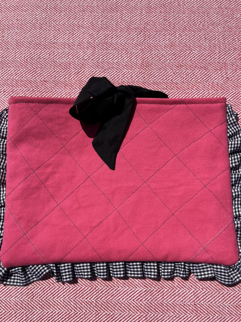 Hand sewn pink quilted book sleeve with slogan
