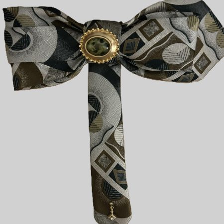 Handmade Bow in gray, brown, and green abstract geometric silk design.