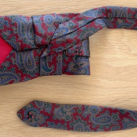 Stylish Handmade necktie accessory in a vintage-style burgundy paisley printed silk tie paired with a crystal floral brooch