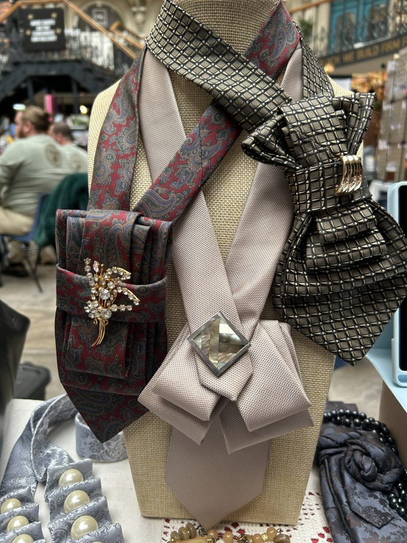 Stylish Handmade necktie accessory in a vintage-style burgundy paisley printed silk tie paired with a crystal floral brooch