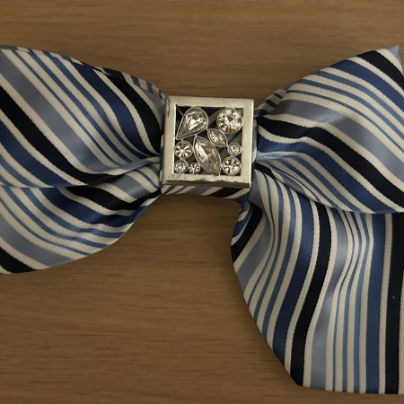 Elegant blue striped bow tie with a rhinestone accent.