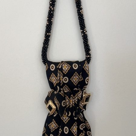 Handmade black silk necktie with a gold and white geometric pattern and decorative gold accents necktie.