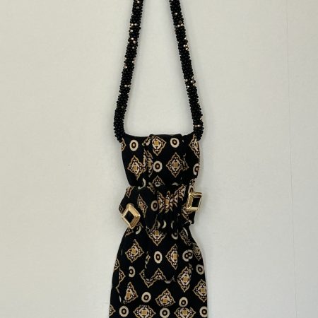 Handmade black silk necktie with a gold and white geometric pattern and decorative gold accents necktie.