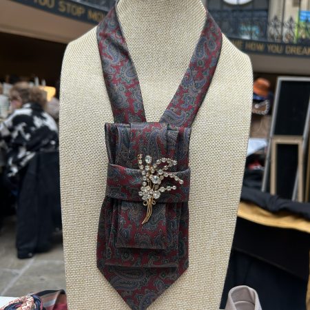 Stylish Handmade necktie accessory in a vintage-style burgundy paisley printed silk tie paired with a crystal floral brooch