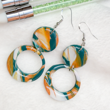 Orange, turquoise and white double drop hoop polymer earrings.